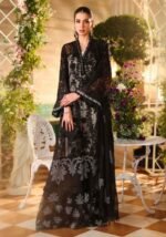 Girl standing in black Maria B dress